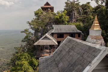 Lampang, Thailand - Sep 03, 2020 : Pagoda on top of the cliff high mountain at Chaloem Phrakiat Phrachomklao Rachanuson temple (Wat Phrabat Pu Pha Daeng) Chae-Hom District, Lampang province, Unseen 