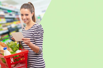 Woman doing grocery shopping with a shopping list