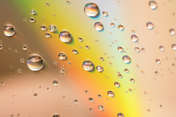 Water drops on glass surface in the sun.