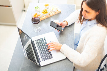 woman using smartphon during aperitif