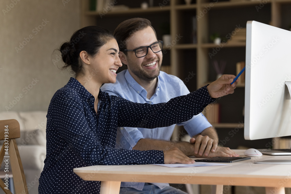 Canvas Prints Happy young Indian ethnicity female manager discussing online sales, marketing research results or corporate growth strategy with smiling male team leader or colleague, working together in office.