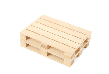 Two small wooden pallets stacked on white background