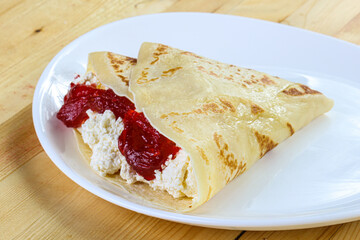 Pancake with cottage cheese and jam