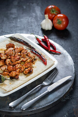 turkish sis kebab, salad, lavash, buttermilk, on the dark bacground