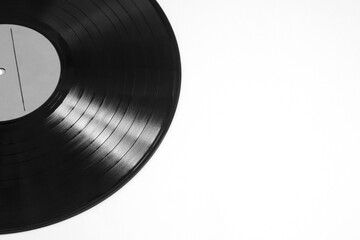 Vinyl record on a white background. Black and white image.