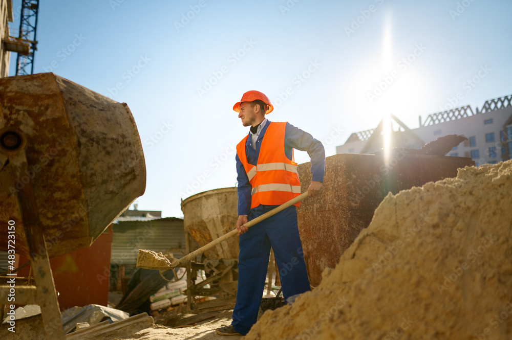 Wall mural Male worker making concrete at construction site