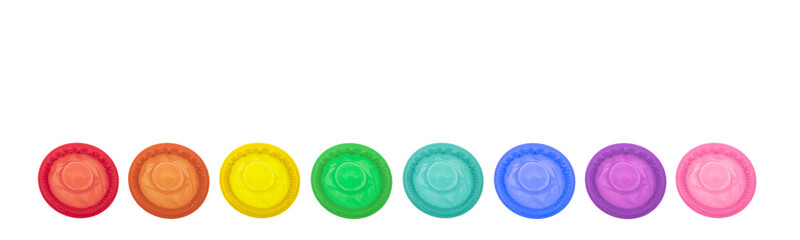 Flat lay composition with colorful condoms on white background, space for text. LGBT concept
