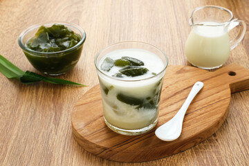 Es Cincau Hijau (green grass jelly), a traditional Indonesian dessert. Made from cincau, coconut milk and palm sugar. Selected focus.
