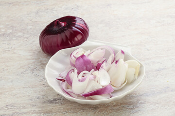 Sliced red onion in the bowl