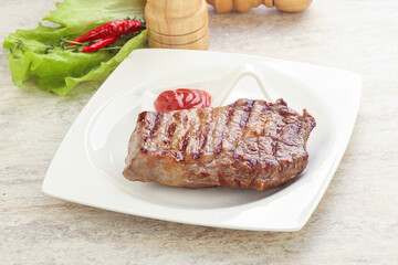 Grilled rib-eye steak beef meat