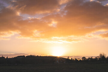 Naklejka premium sunset over the field