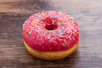 Sweet glazed struwberry donut with icing