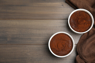 Delicious fresh chocolate fondant on wooden table, flat lay. Space for text