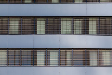 background of facade with shutter blinds of an office building