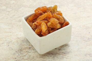 Sweet yellow raisin in the bowl