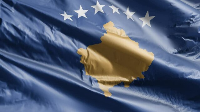 Kosovo flag slow waving on the wind loop. Kosovsky banner smoothly swaying on the breeze. Full filling background. 20 seconds loop.