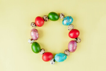 Colorful Easter egg side border over a yellow paper background