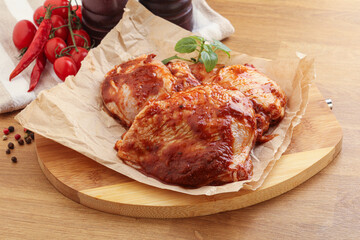 Marinated chicken leg in tomato sauce