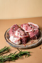 Raw pork steak on a plain background. Raw meat