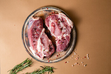 Raw pork steak on a plain background. Raw meat