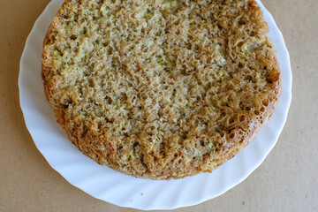 Charlotte pie, top view. Homemade bakery. Apple pie on a white plate for publication, design, poster, calendar, post, screensaver, wallpaper, postcard, card, banner, cover, website