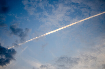 Fototapeta na wymiar airplane trail in the sky
