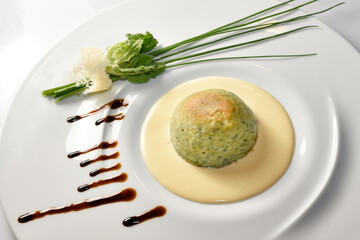 Vegetable flan with fondue fontina cheese in white plate with herb, Italian food recipes