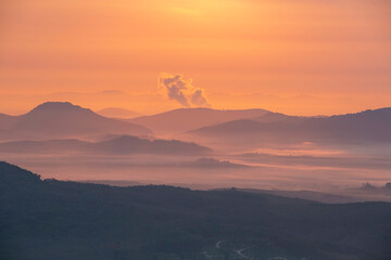 Mountains and the morning atmosphere where the golden sun shines down