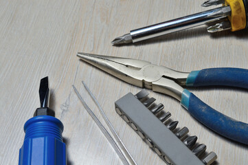 a working tool for minor repairs is laid out on the table