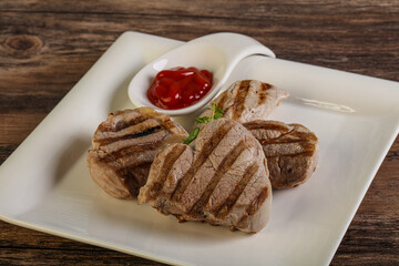 Grilled pork tenderlion with tomato sauce
