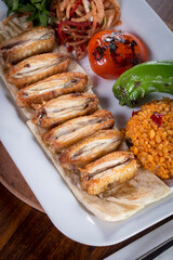 grilled wings with tomato pepper and bulgur pilaf