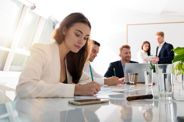 Business people in office work together during a meeting
