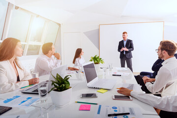 Business people in office work together during a meeting