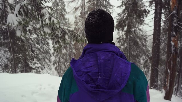 Man in the snow forest