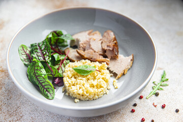 bulgur with meat and leaves lettuce mix fresh portion dietary healthy meal food diet still life snack on the table copy space food background rustic top view keto or paleo diet