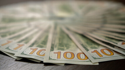 Hundred dollar bill, Hand holding money, 100 dollar bills in hand.
Forest sale