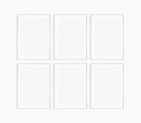 Frame mockup 5x7, 50x70, A4, A3, A2, A1. Set of six thin light wood frames. Gallery wall mockup, set of 6 frames. Clean, modern, minimalist, bright. Portrait. Vertical. Mat opening 2:3.