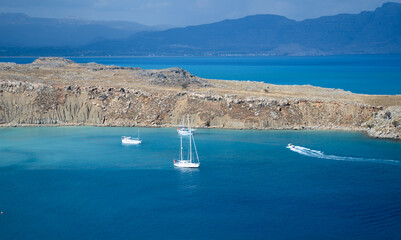 bay with blue sea yachts