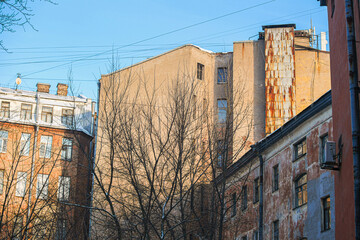 old houses in St. Petersburg, windows are close, pigeons flying