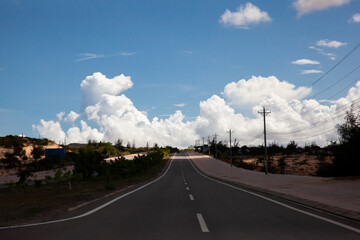 Coastal road in Phan Thiet, Mui Ne, Viet Nam. beautiful landsacpe with blue sky and white cloud in summer day