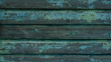 Fototapeta premium Vintage wood background. Old weathered wooden plank painted in blue color. Boards with cracked and peeling paint. Old painted wood wall - texture or background.