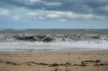 sea storm on sand beach 