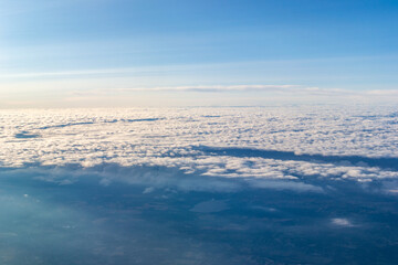 Obraz premium Arial view of clouds from aeroplane