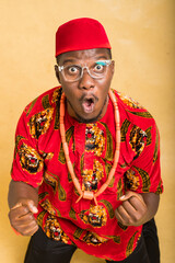 Igbo Traditionally Dressed Business Man in Glasses winning close up