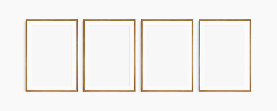 Frame mockup 5x7, 50x70, A4, A3, A2, A1. Set of four thin cherry wood frames. Gallery wall mockup, set of 4 frames. Clean, modern, minimalist, bright. Portrait. Vertical. Mat opening 2:3.