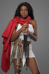 Military black woman with gladius and red cape