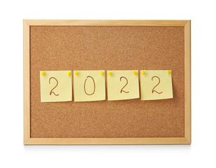 Board with sticky notes and figure 2022 on white background