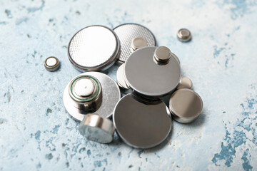 Lithium button cell batteries on light background, closeup