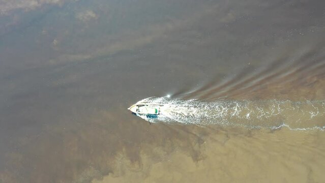 Panning wide view of peaceful darm river at coastal city of Itanhaem Sao Paulo Brazil. South coast of state of Sao Paulo. Tropical scenery. Travel destinations. Popular tourism landmark.