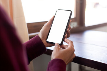 cell phone blank white screen mockup.hand holding texting using mobile on desk at office.background empty space for advertise.work people contact marketing business,technology